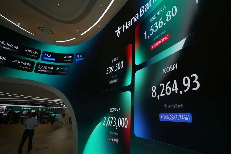 Asian shares are mixed as  tech stocks fall in Japan and South Korea
