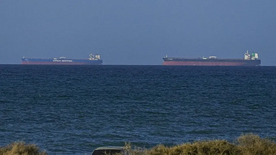 Tanker set ablaze after being struck by projectile in the Strait of Hormuz off the coast of Oman